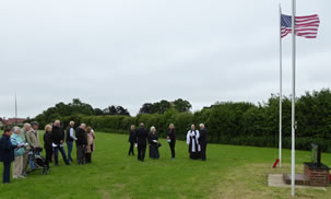 people gather under grey skies